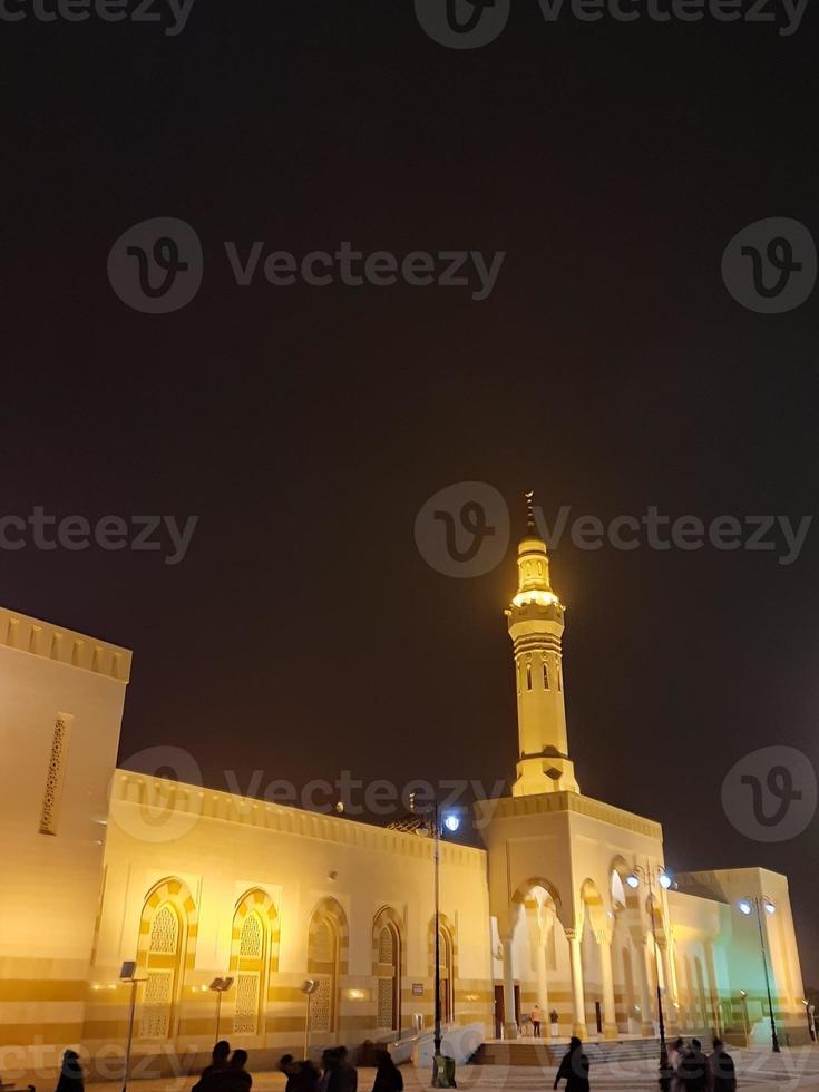 A beautiful night view of the Sayed Al Shuhada Mosque in Medina, Saudi Arabia. photo