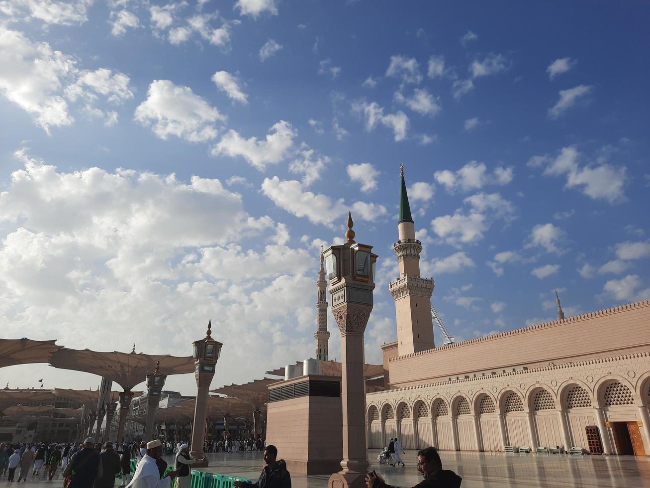 Medina, Saudi Arabia, Dec 2022 - During the day pilgrims from all over the world gather in the outer courtyard of Masjid Al Nabawi, Madinah, Saudi Arabia. photo