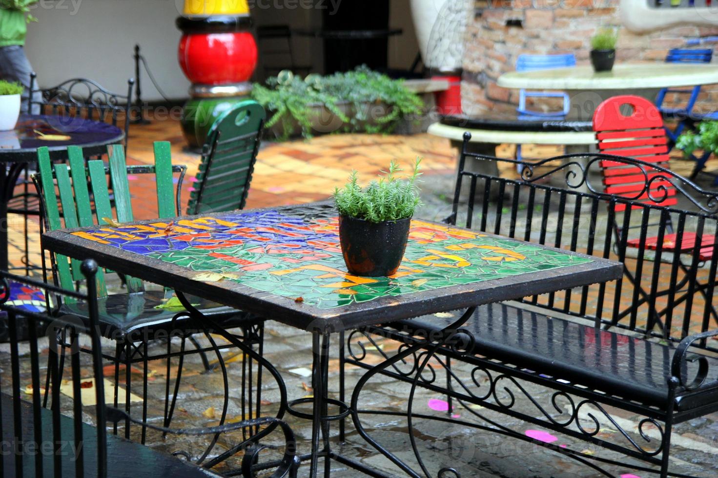Travel to Vienna, Austria. The empty tables in the cozy cafe in the rainy day. photo