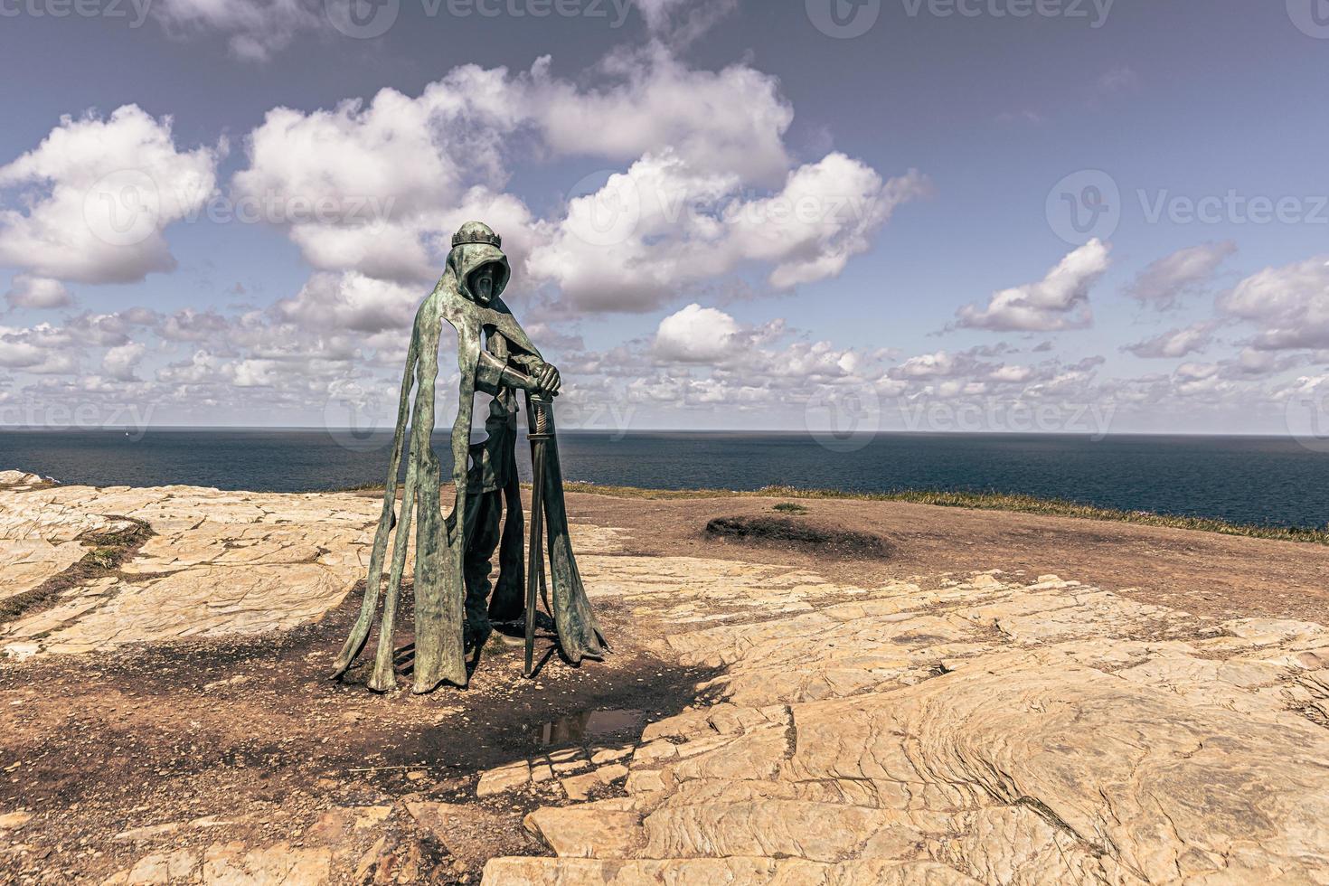 Statue of the legendary King Arthur in the ancient town of Tintagel in Cornwall, England. photo