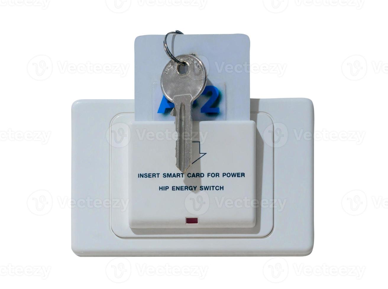 Smart card with key inserted into white socket with text reading Insert smart card for power installed on white wall in luxurious hotel or resort room isolated on white background with clipping path photo