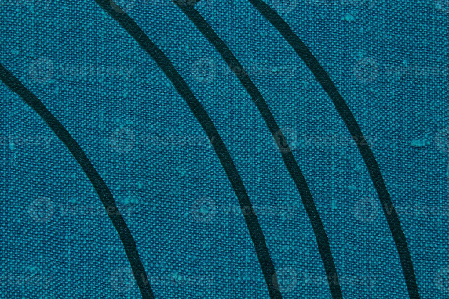 Abstract design background of blue coarse-grained intersection texture of rough fabric with an interlacing black painted lines. Linen sack textile canvas burlap cloth. Close-up, mock up, top view photo