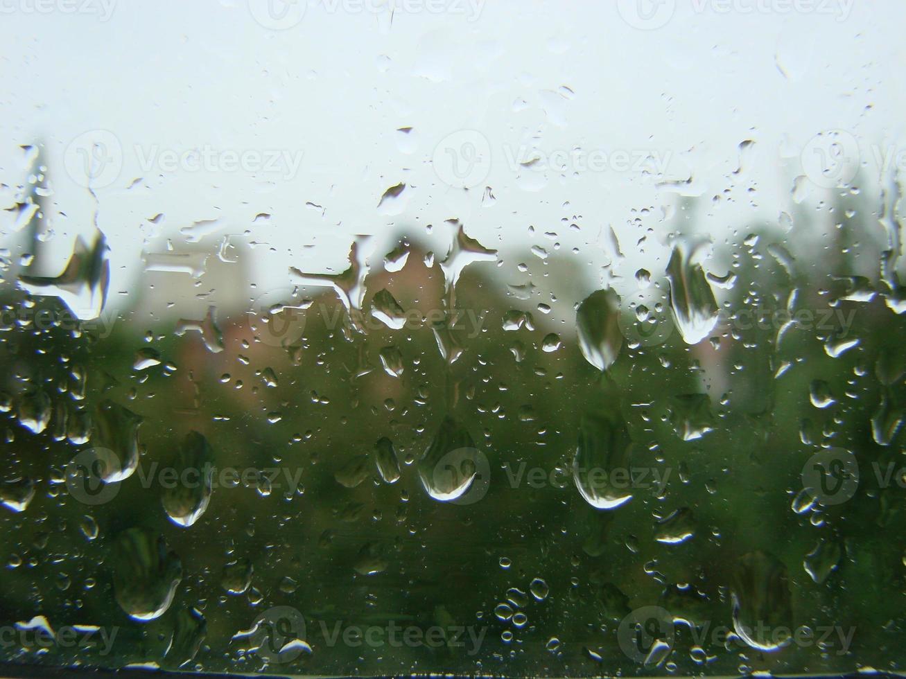 rainy days rain drops on the window surface photo