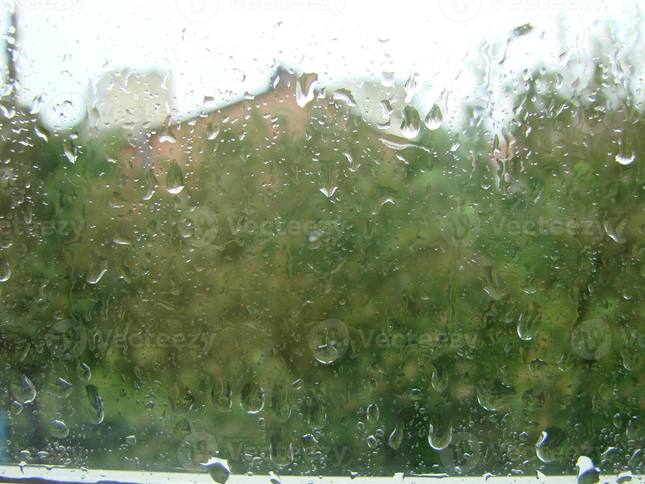 rainy days rain drops on the window surface photo