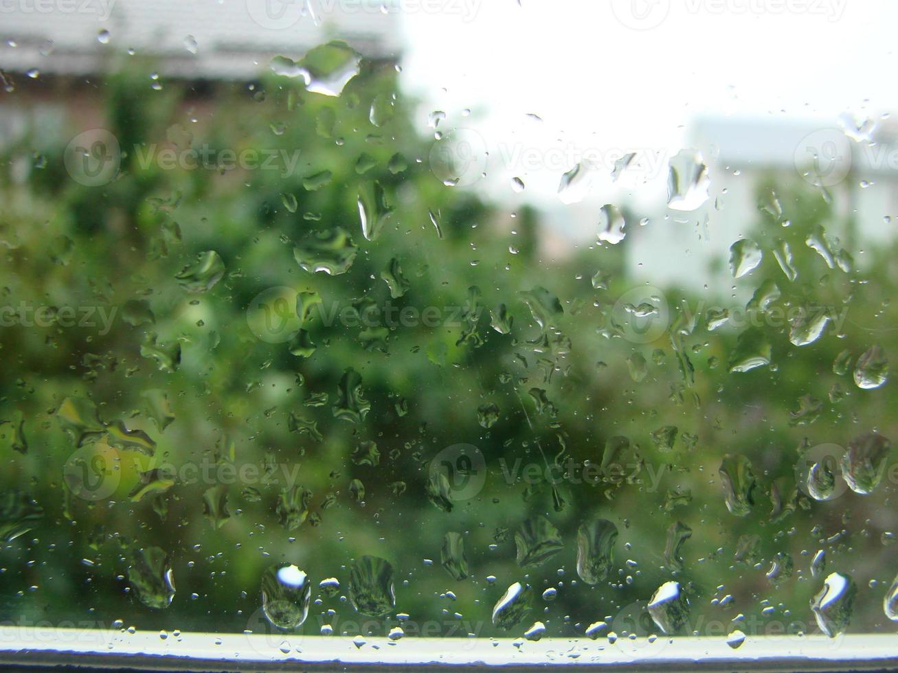 rainy days rain drops on the window surface photo