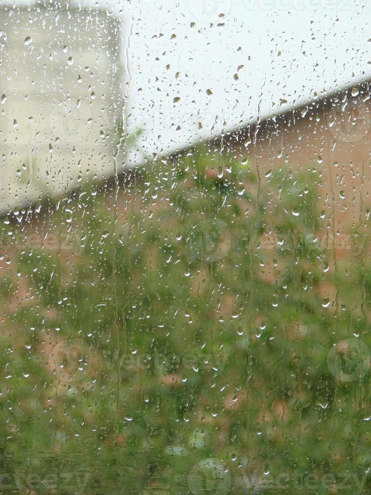 rainy days rain drops on the window surface photo