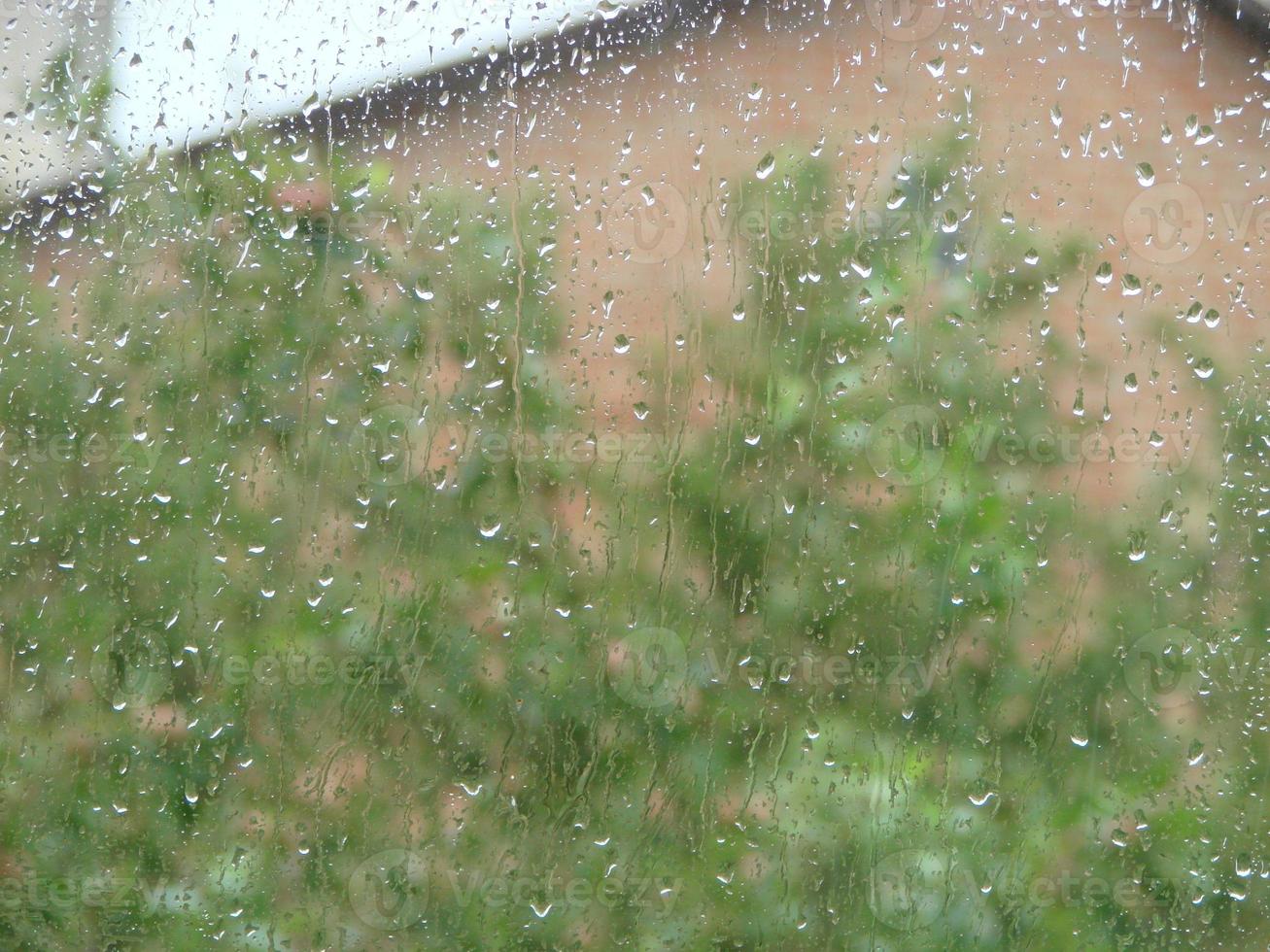 rainy days rain drops on the window surface photo