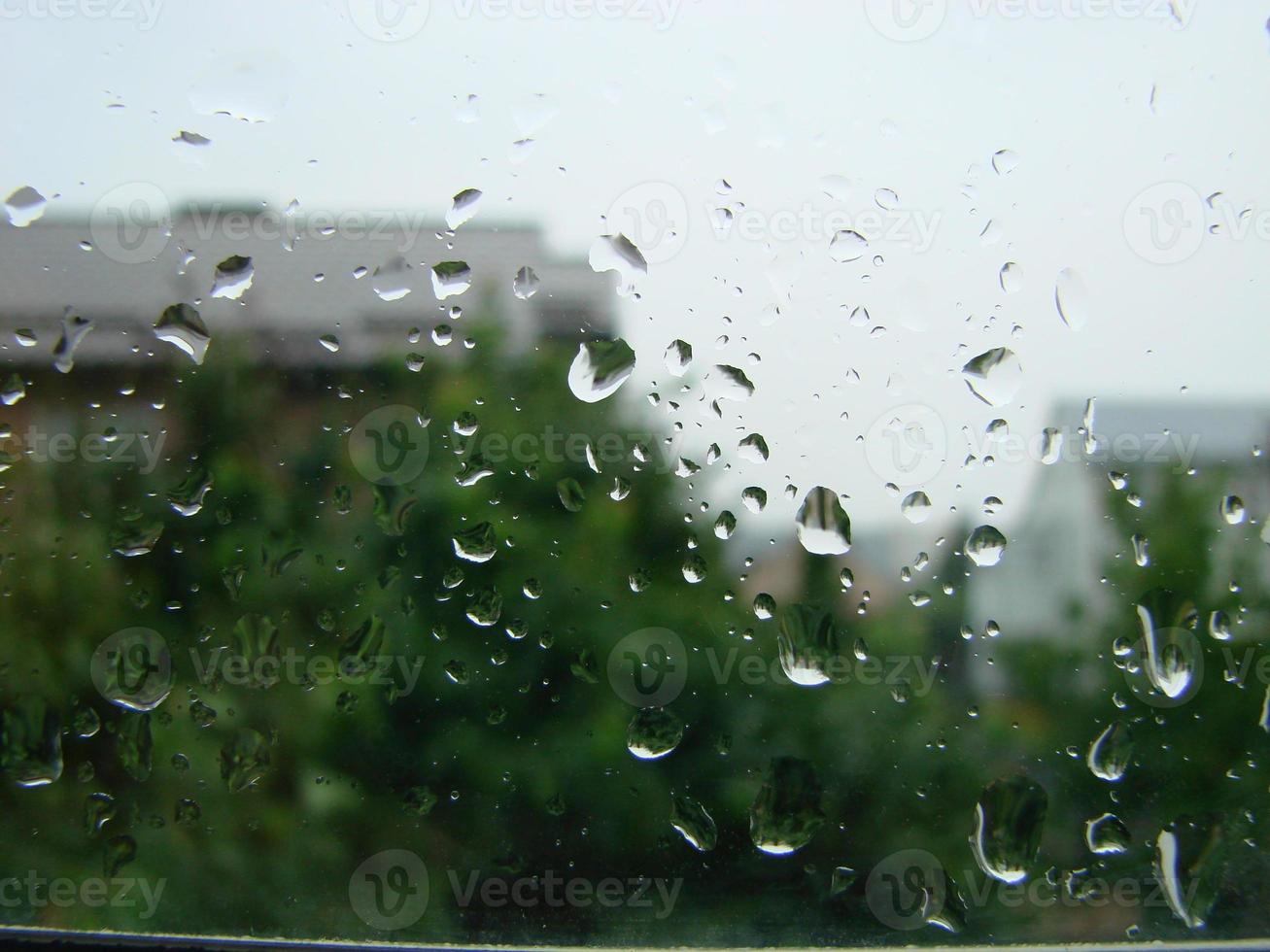 rainy days rain drops on the window surface photo