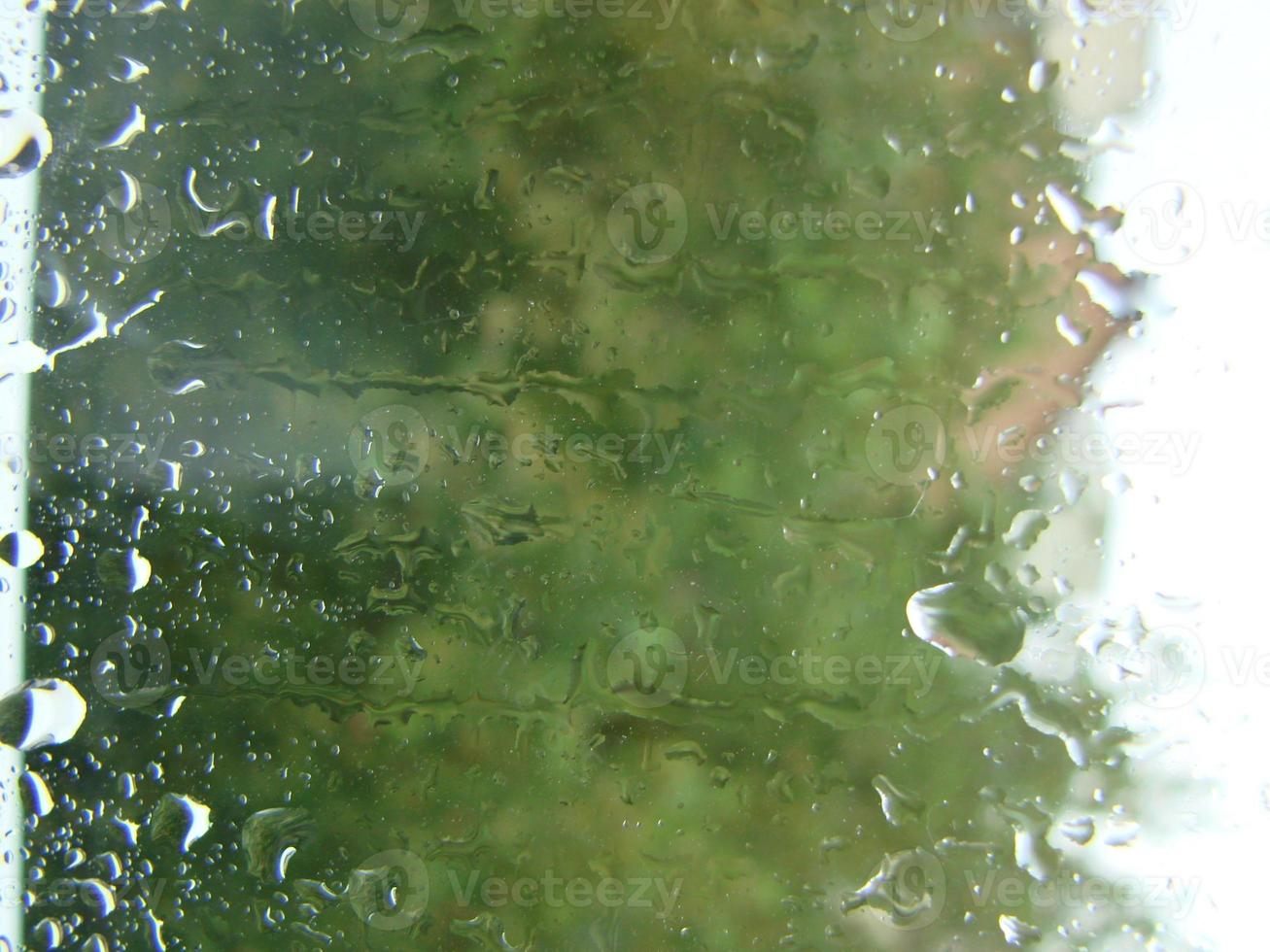 rainy days rain drops on the window surface photo