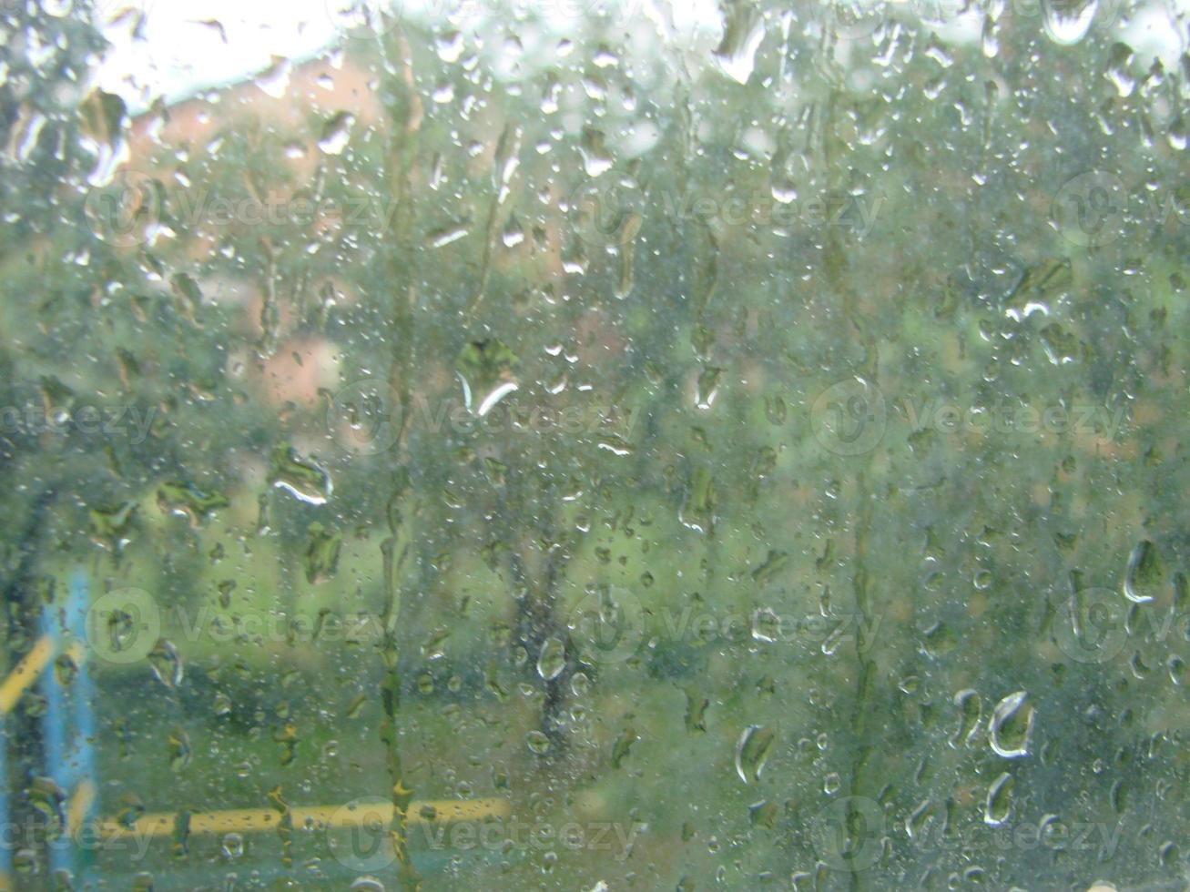 rainy days rain drops on the window surface photo