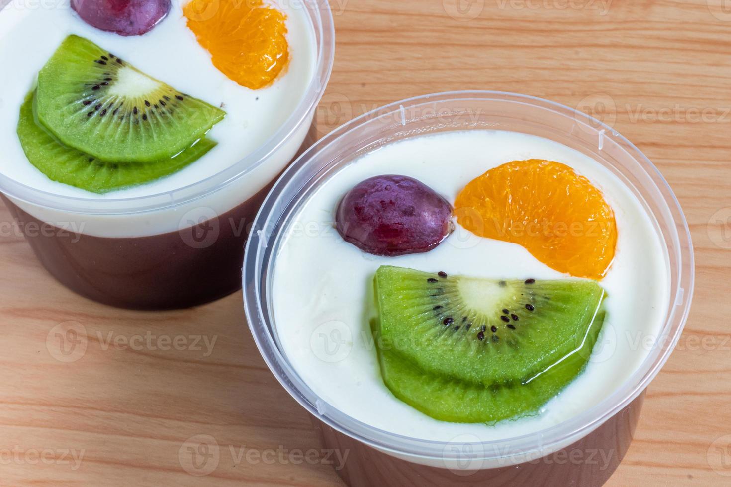 Fruity milk pudding, sweet chocolate silk pudding dessert with fruit topping photo