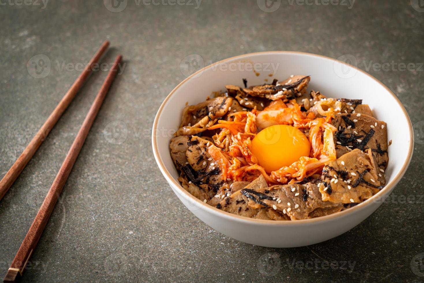 pork bulgogi rice bowl with kimchi and Korean pickled egg photo