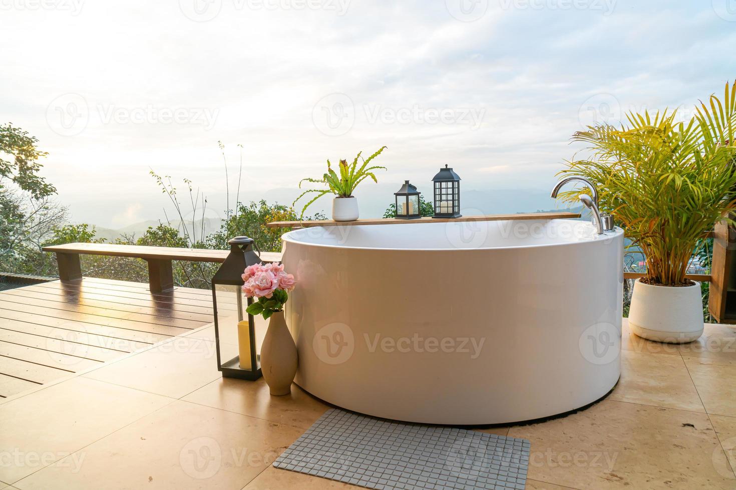 outdoor bath tub with beautiful mountain view background photo