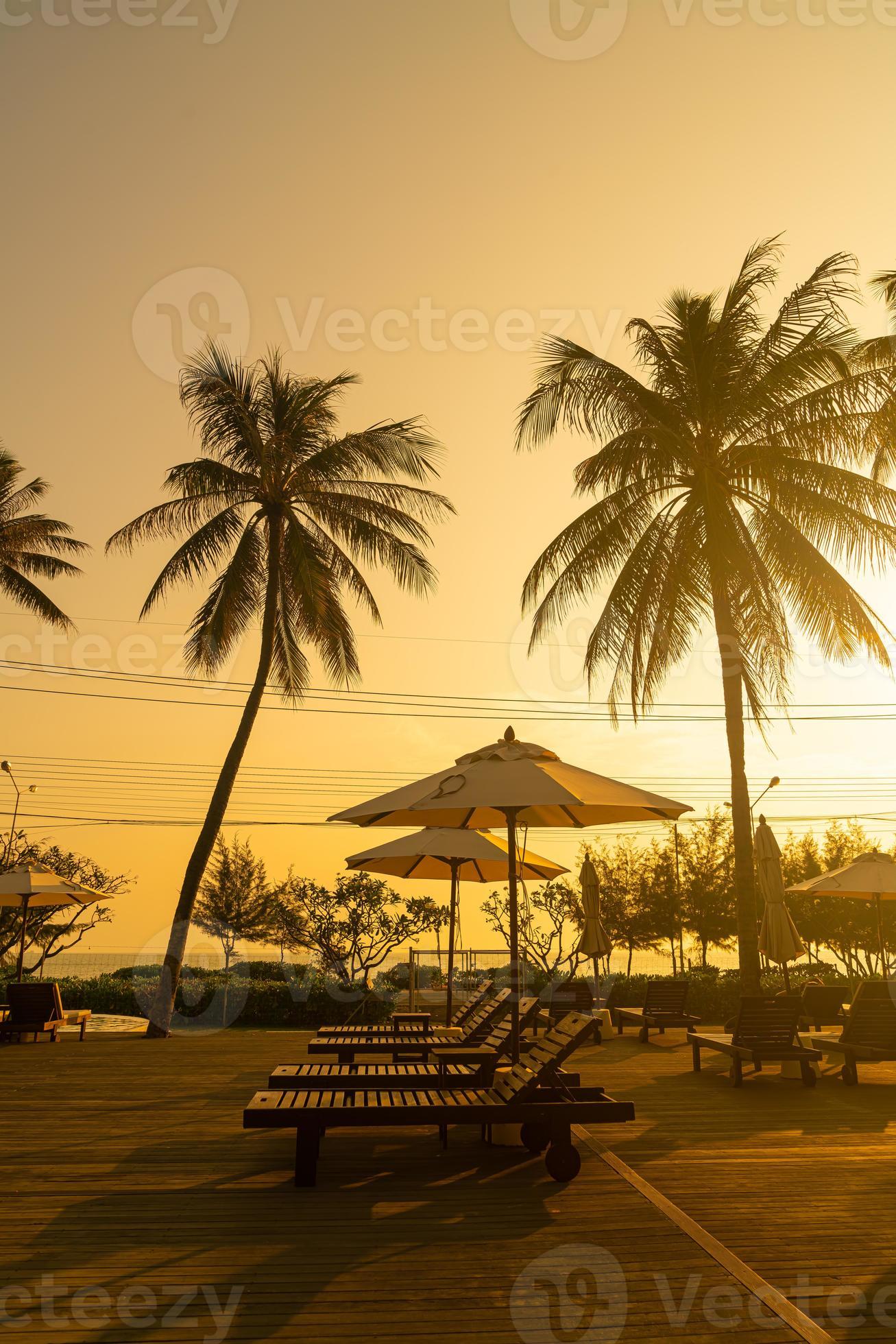 umbrella with bed pool around swimming pool with ocean sea background