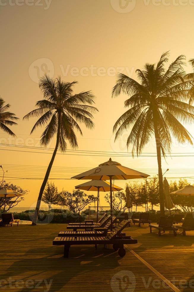 umbrella with bed pool around swimming pool with ocean sea background