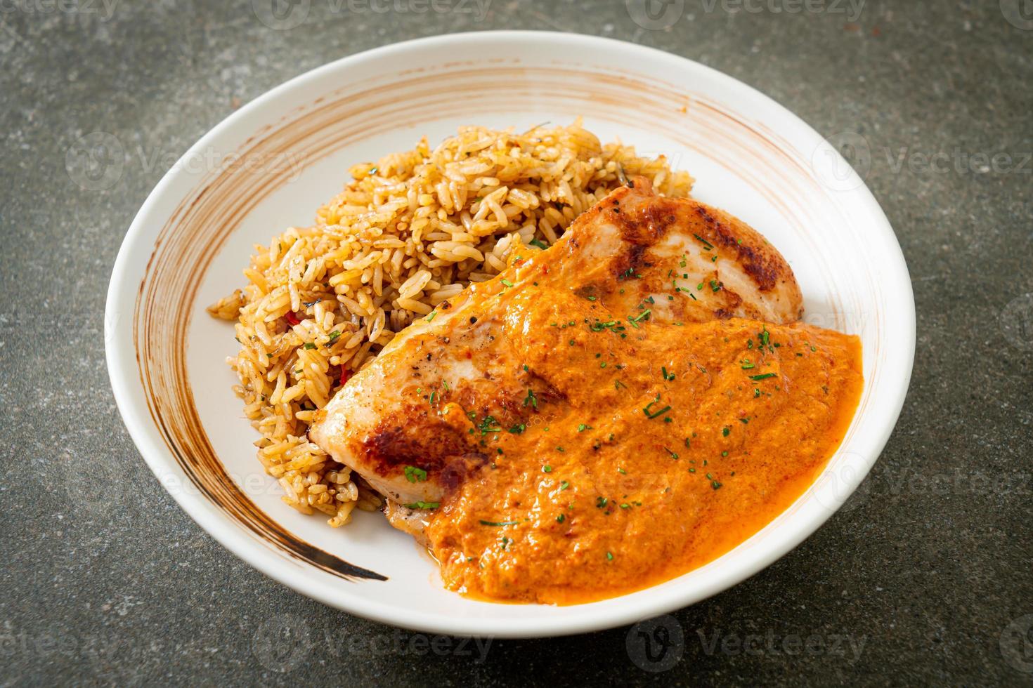 grilled chicken steak with red curry sauce and rice photo