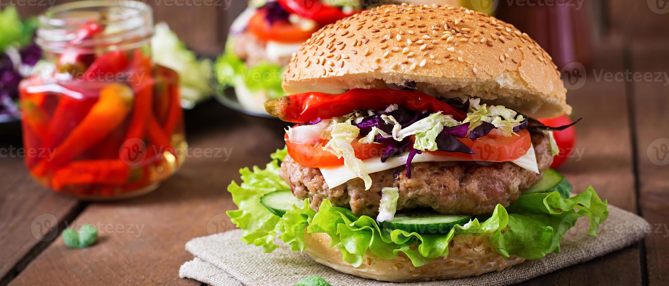 Sandwich hamburger with juicy burgers, cheese and mix of cabbage photo