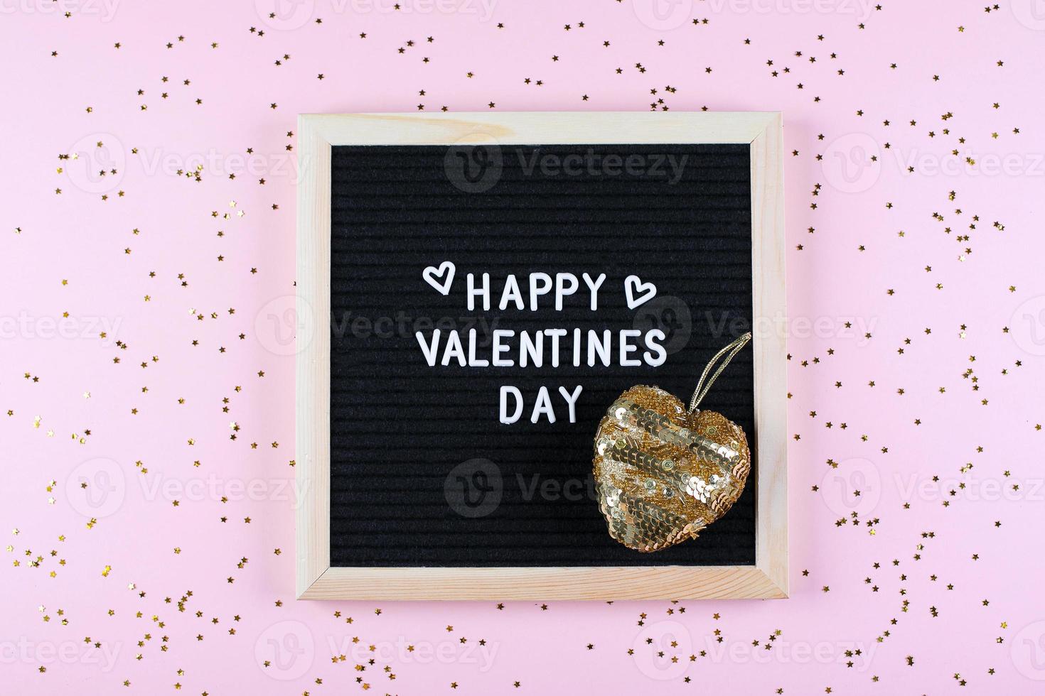 Happy Valentines Day Card. Letters board with text and gold heart. Flat lay, top view photo