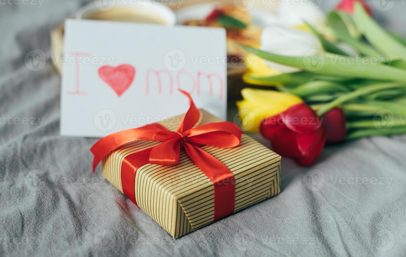 Close-up of gift present box for Mother's day. Festive brunch or breakfast. Good morning concept photo