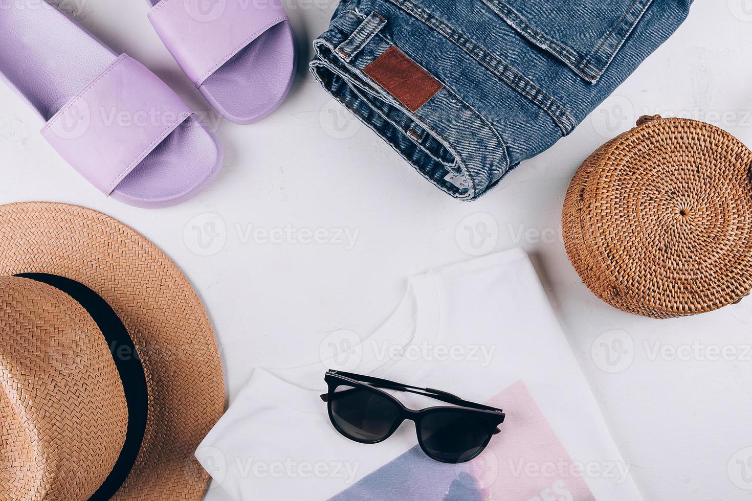 Casual women's clothing, acccessories. T-shirt, summer slippers, shorts, organic rattan bag, hat photo