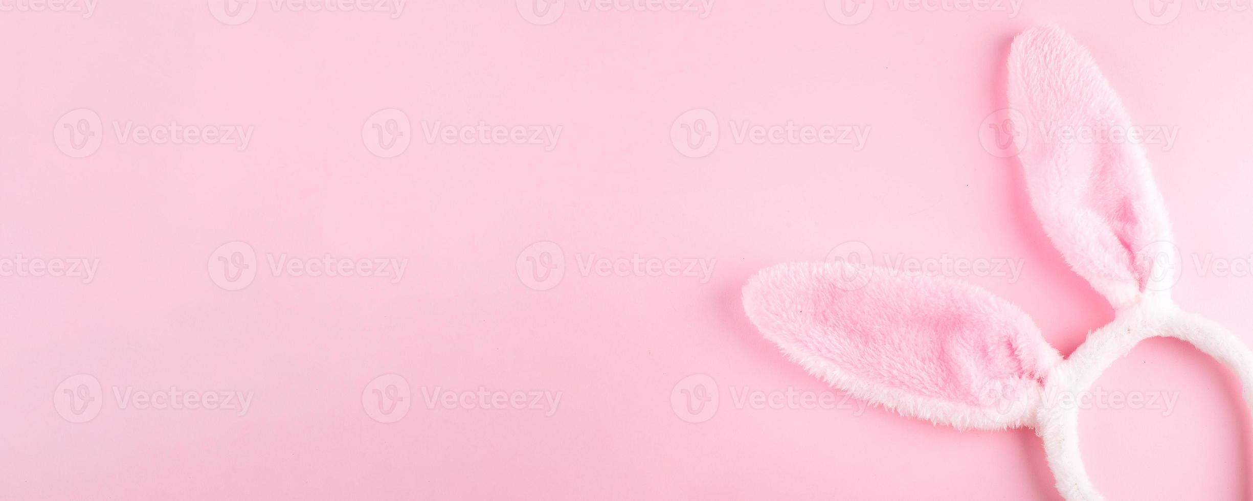 Happy Easter background. Greeting Card. Bunny rabbits on pink background. Easter minimal concept photo