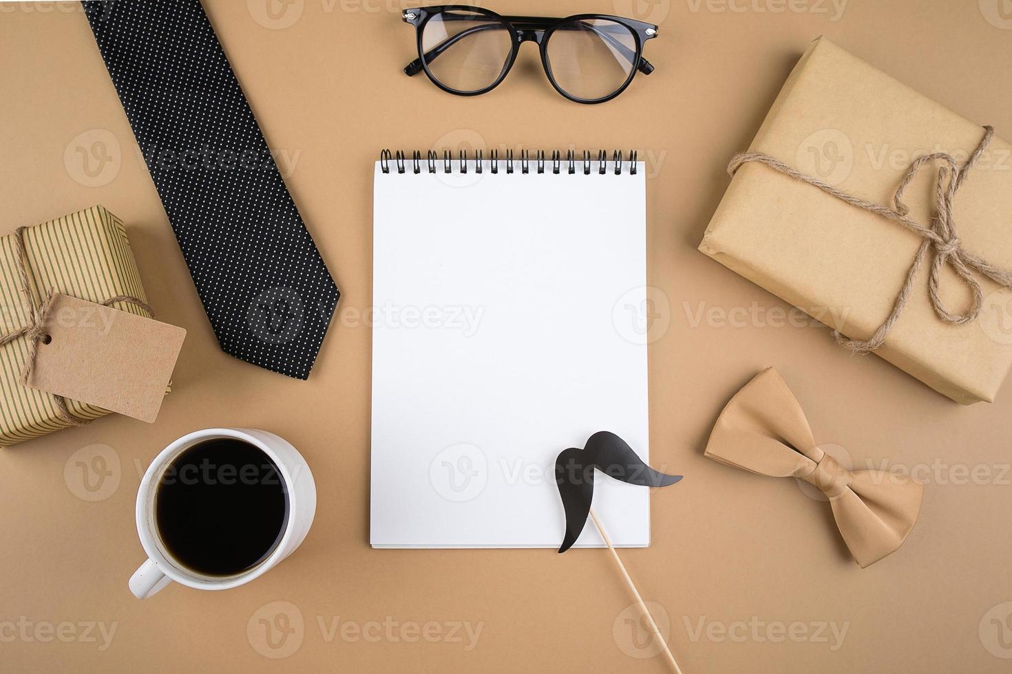 Happy Fathers Day. Gift present boxes, eyeglasses, tie, cup of coffee, butterfly photo