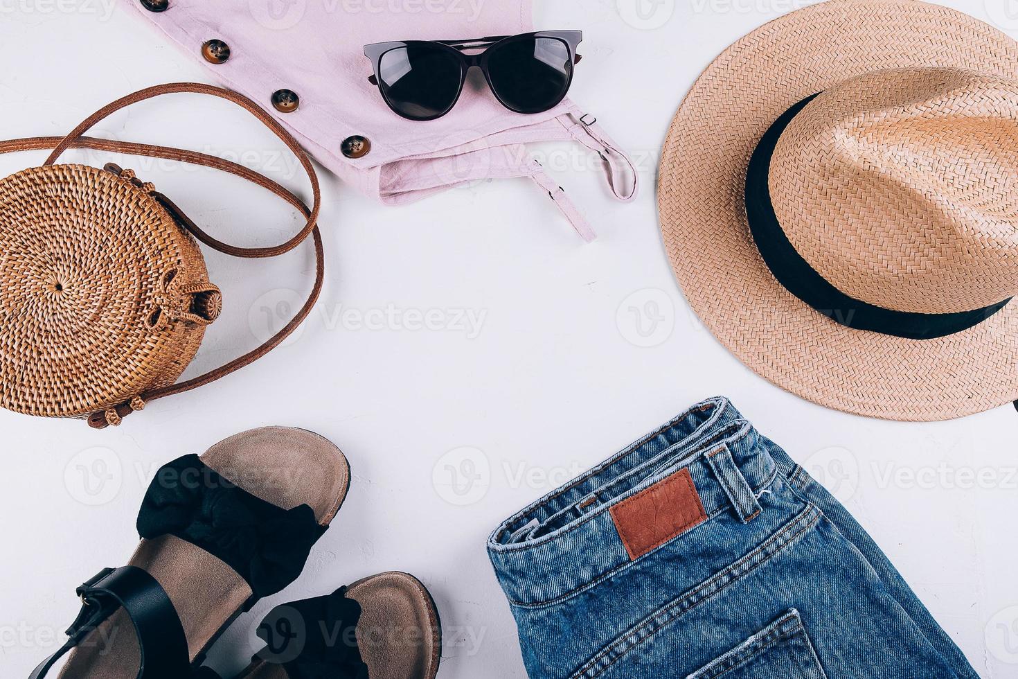 Overhead summer still life. Casual women's clothing, accessories. Vacation, travel concept. Flat lay photo