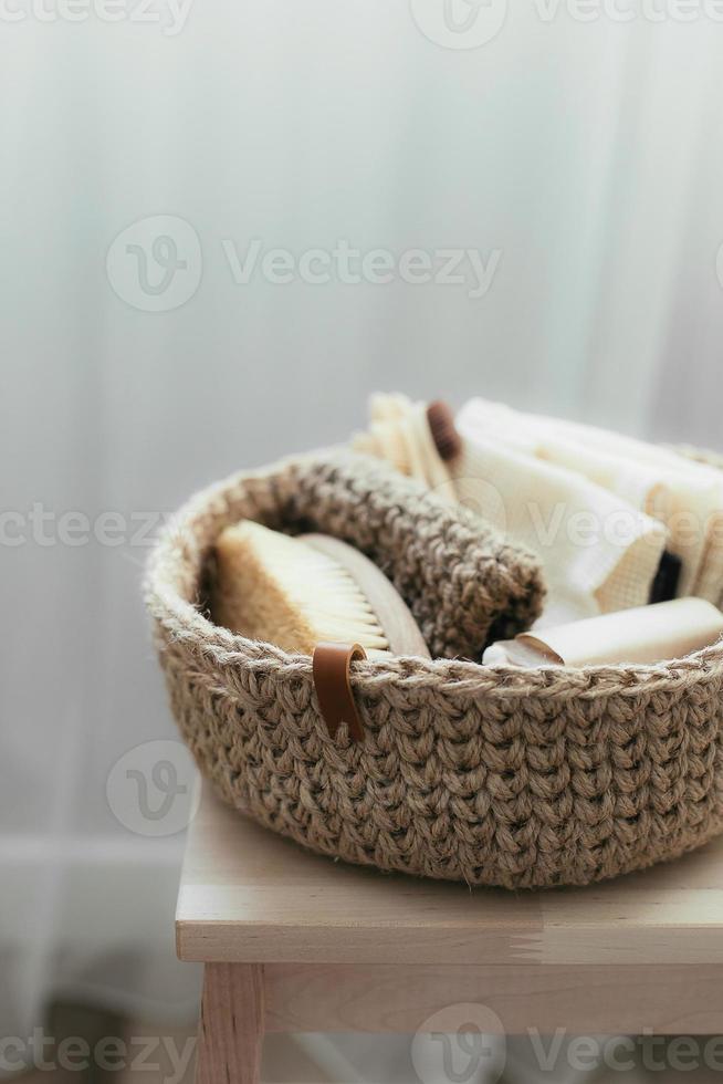 Natural product in jude basket. Bodybrush, toothbrush, shopping bag, soap. Treat yourself concept photo