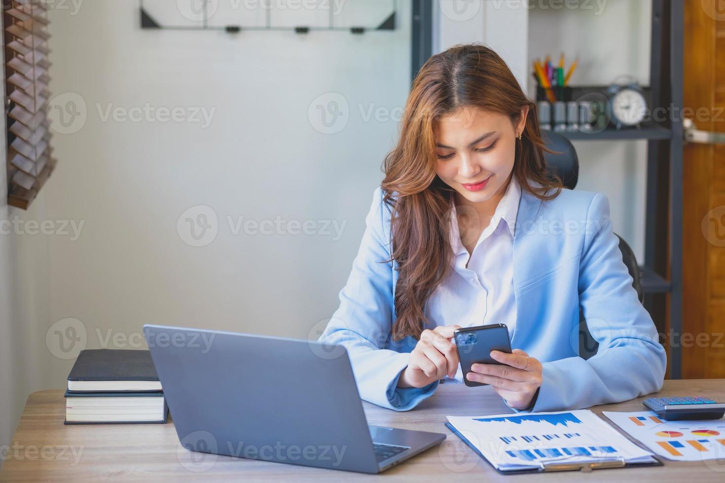 Marketing, Financial, Accounting, Planning, businesswomen uses a mobile phone to contact a customer to inform her of the company is business partnership. photo