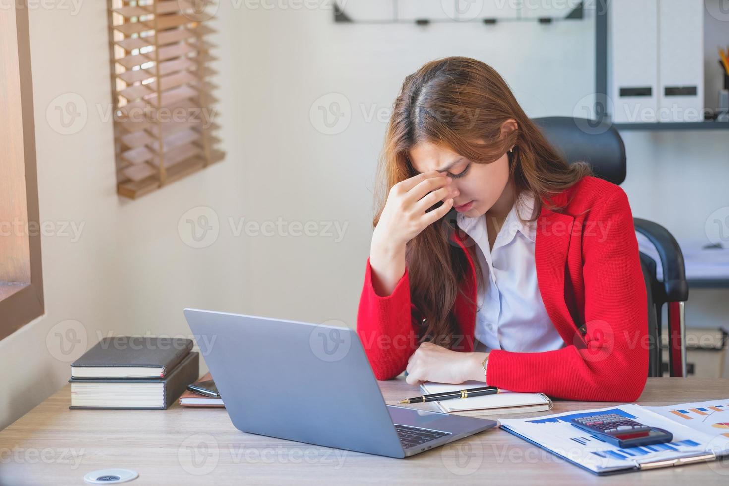 Concept Burnout Syndrome. Business Woman feels uncomfortable working. Which is caused by stress, accumulated from unsuccessful work And less resting body. Consult a specialist psychiatrist. photo