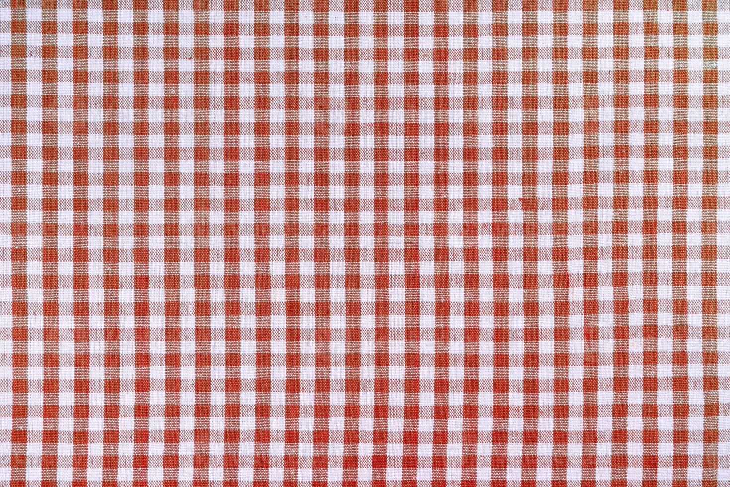 Red classic checkered tablecloth texture, background with copy space. photo