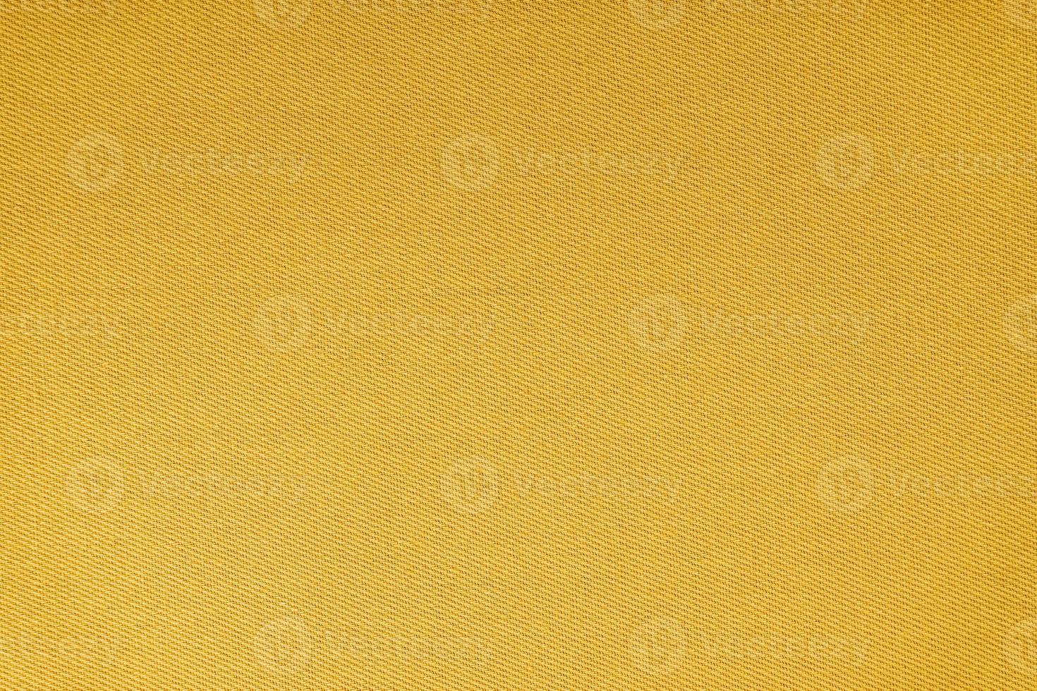 Texture of yellow fabric diagonal weave pattern. Decorative textile background photo