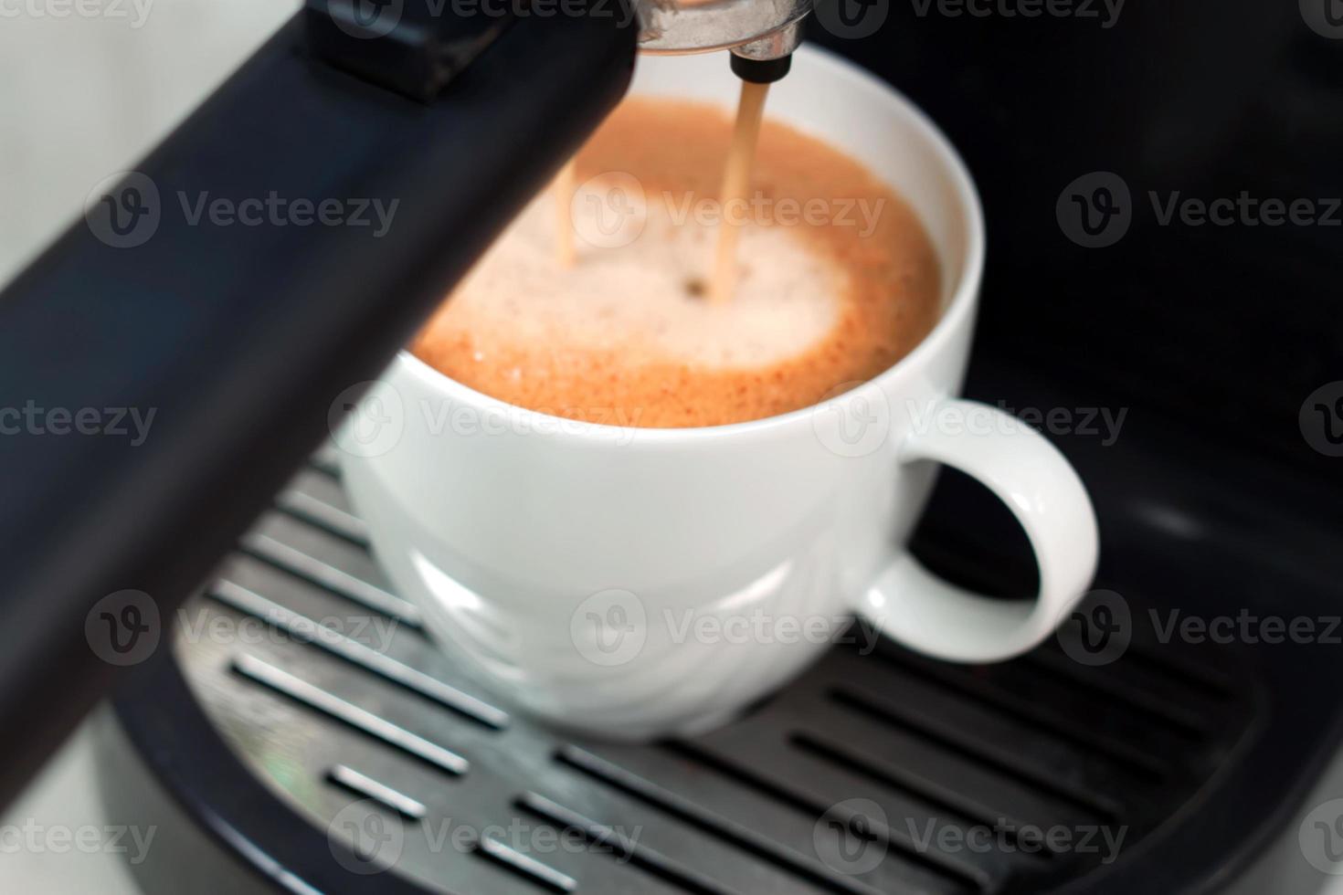 Process of preparing espresso with coffe machine. photo