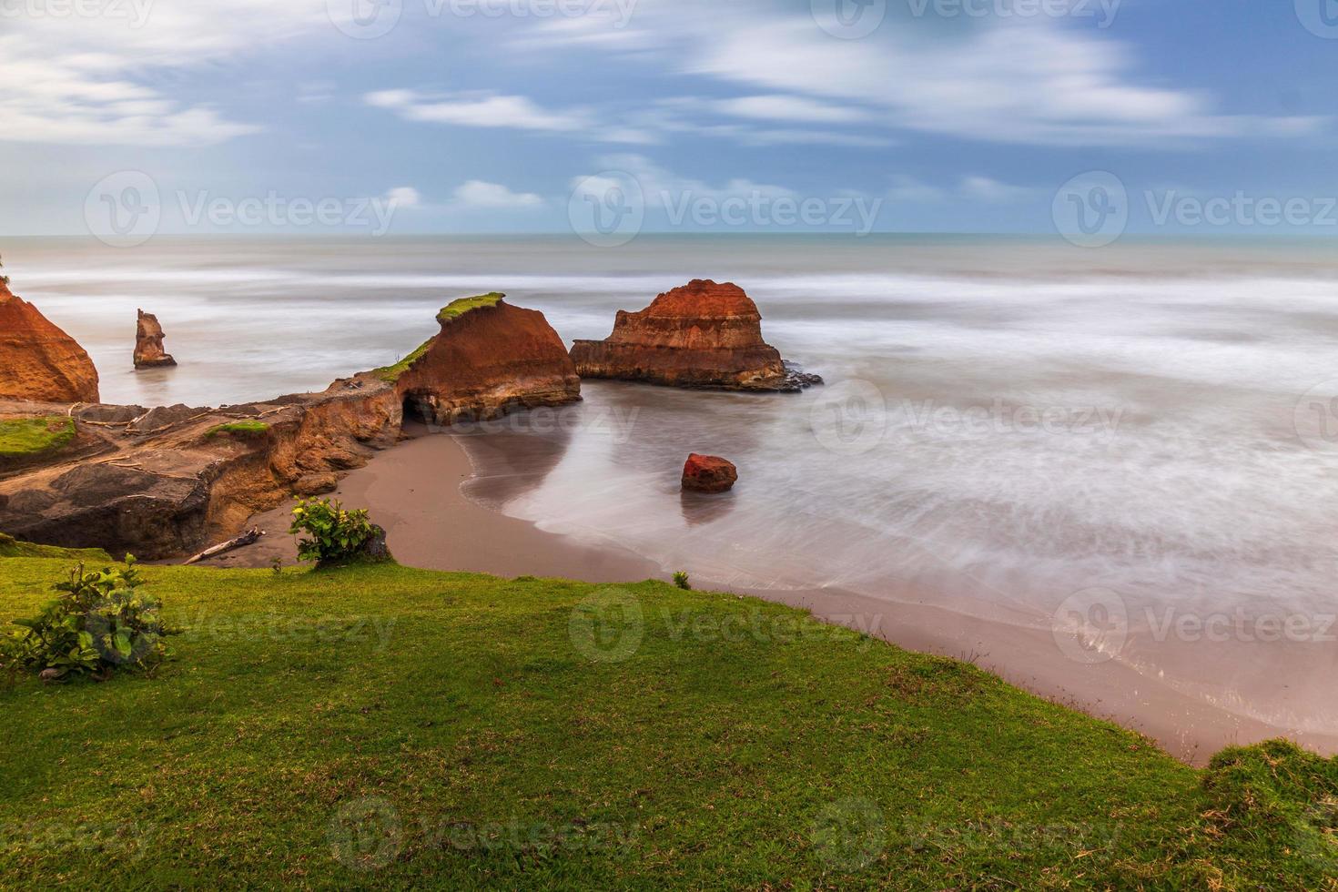Beautiful morning view of Indonesia. beach with soft coral waves and white sand photo