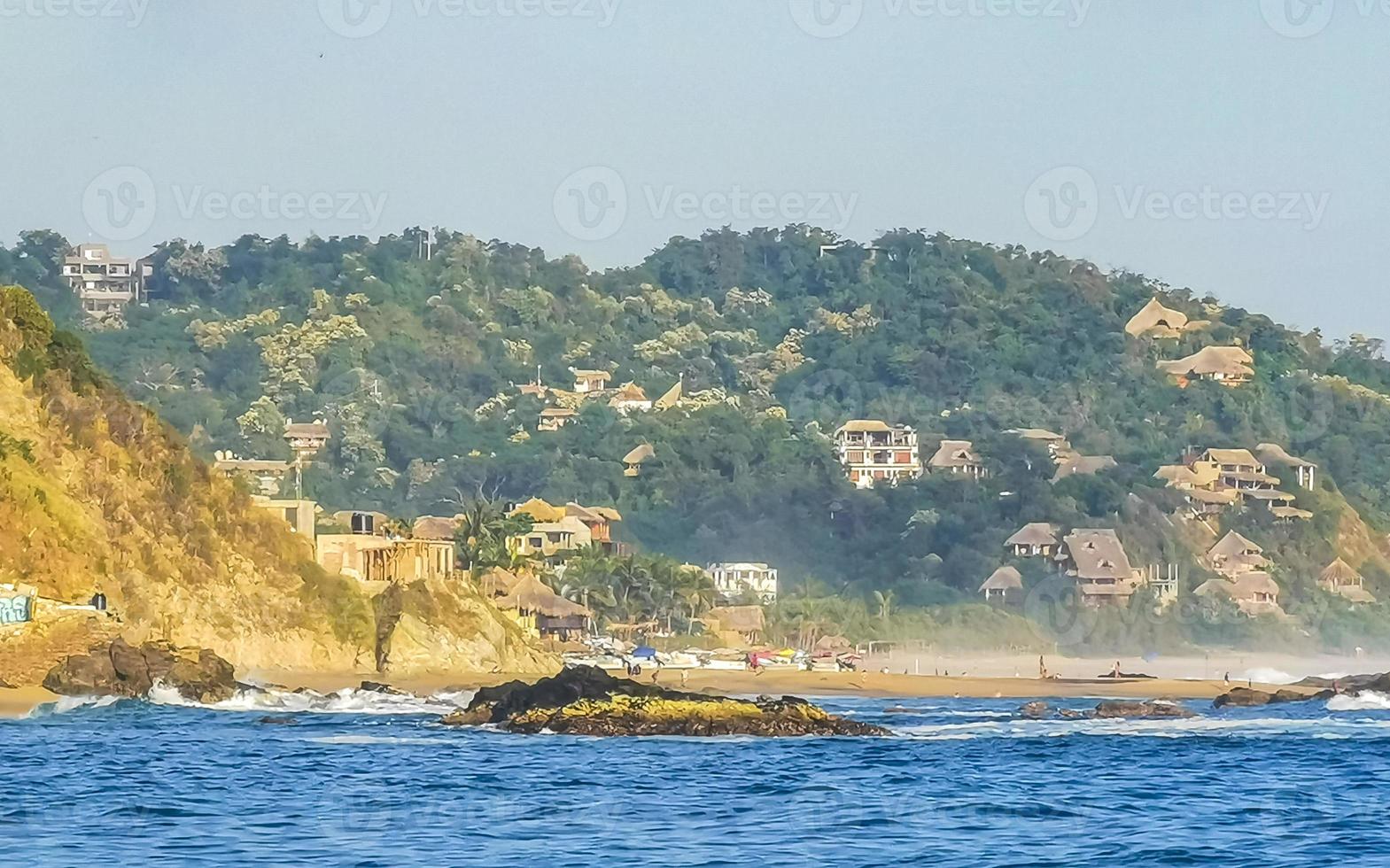 Mazunte Mexico Beautiful paradise beach with mountains cliffs rocks waves. photo