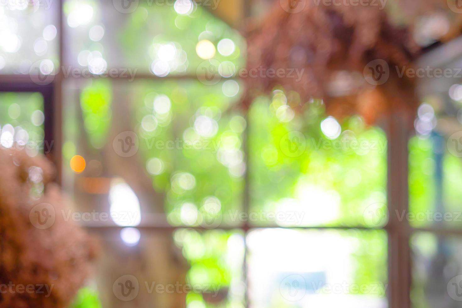 Blurry Bokeh Abstract DeFocus Green Yellow Brown colour in the restaurant that decorate by the tree for Cafe Bokeh Blurry Background. photo