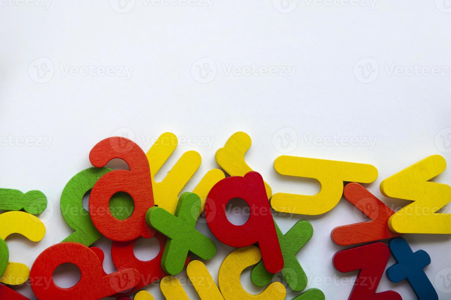 Wooden color letters on white background. Copy space and school concept photo