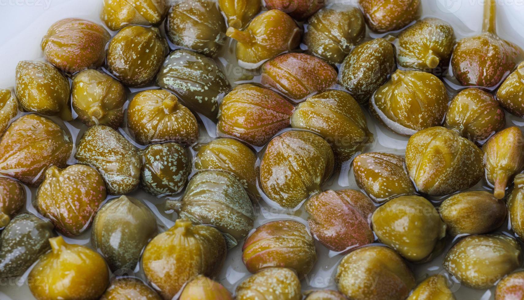 Background of beautiful pickled capers. Capers in brine. 17153319 Stock Photo at Vecteezy