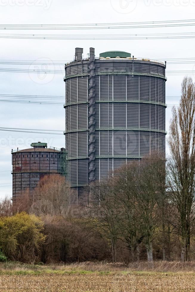large gasometers in an industrial landscape photo