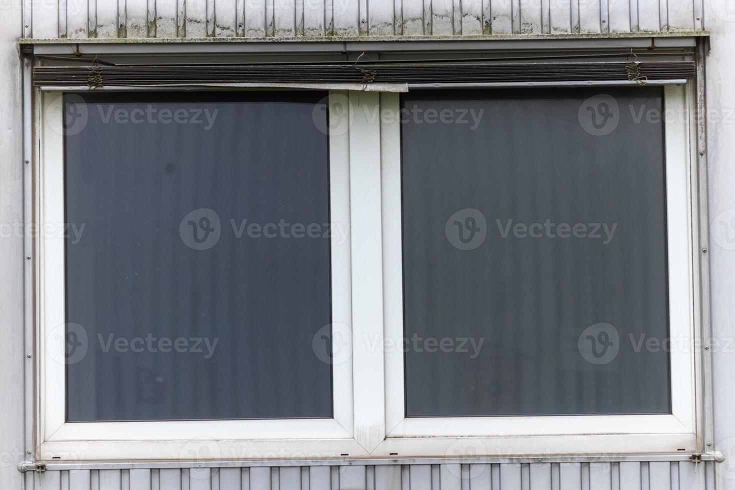old industrial building facade with windows photo