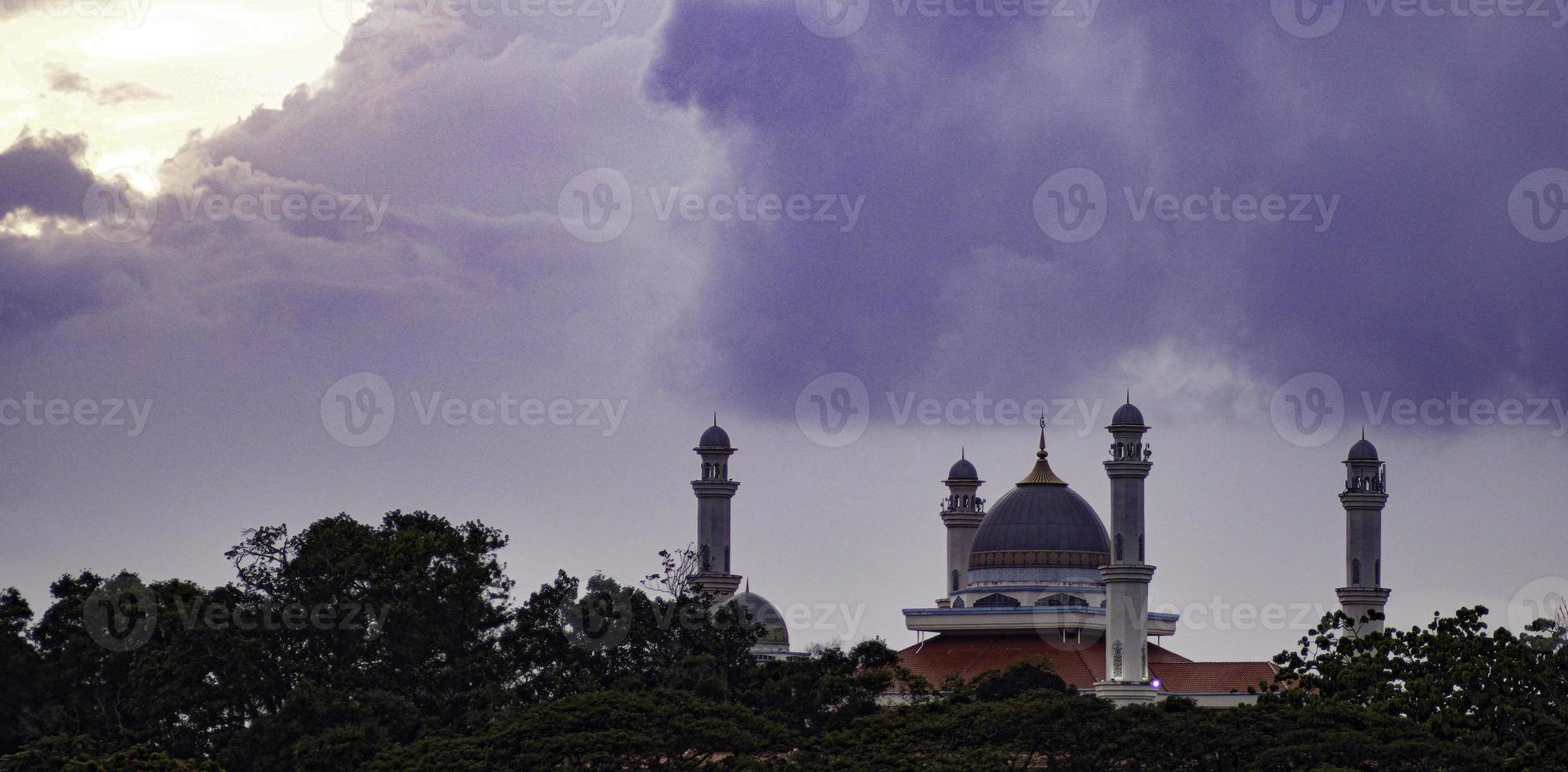 A view of Marang Mosque with beautiful cloud and sunset photo