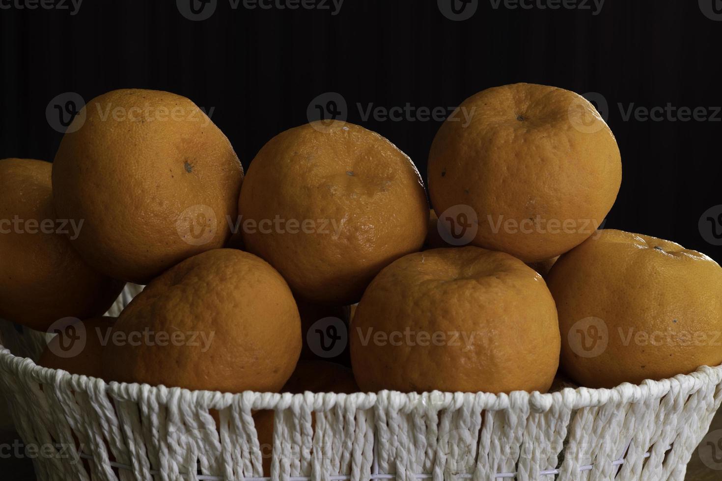 Chinese Lemons in the white beautiful basket for CNY photo