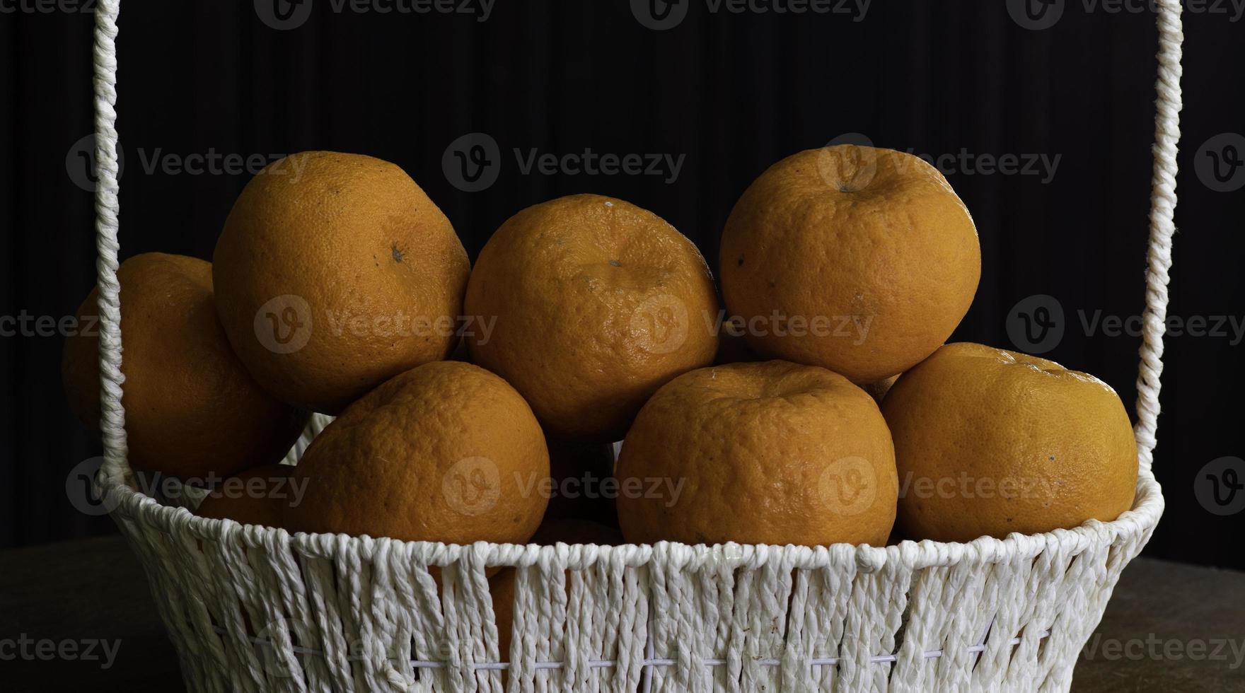 Chinese Lemons in the white beautiful basket for CNY photo