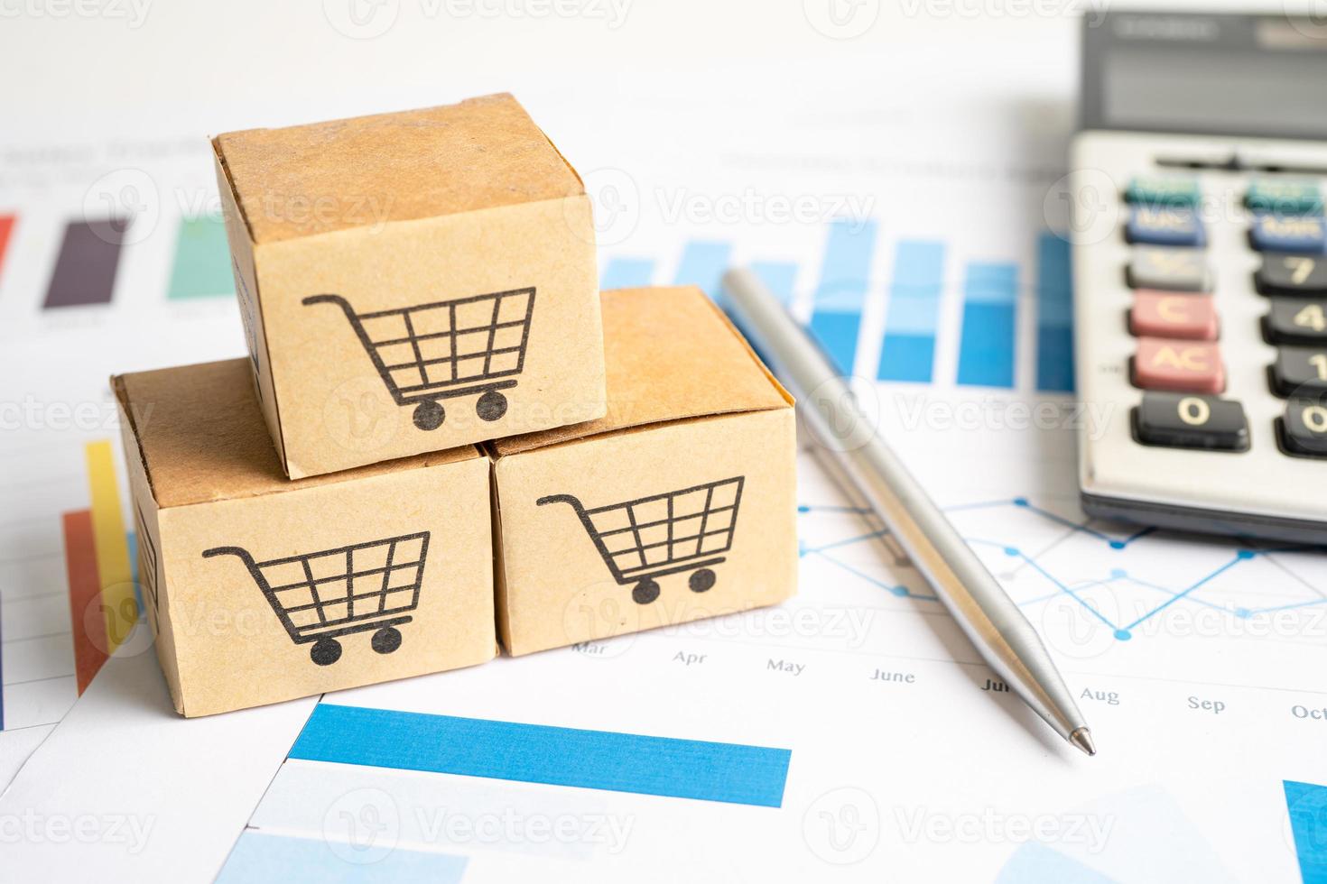 Shopping cart logo on box on graph background. Banking Account, Investment Analytic research data economy, trading, Business import export transportation online company concept. photo