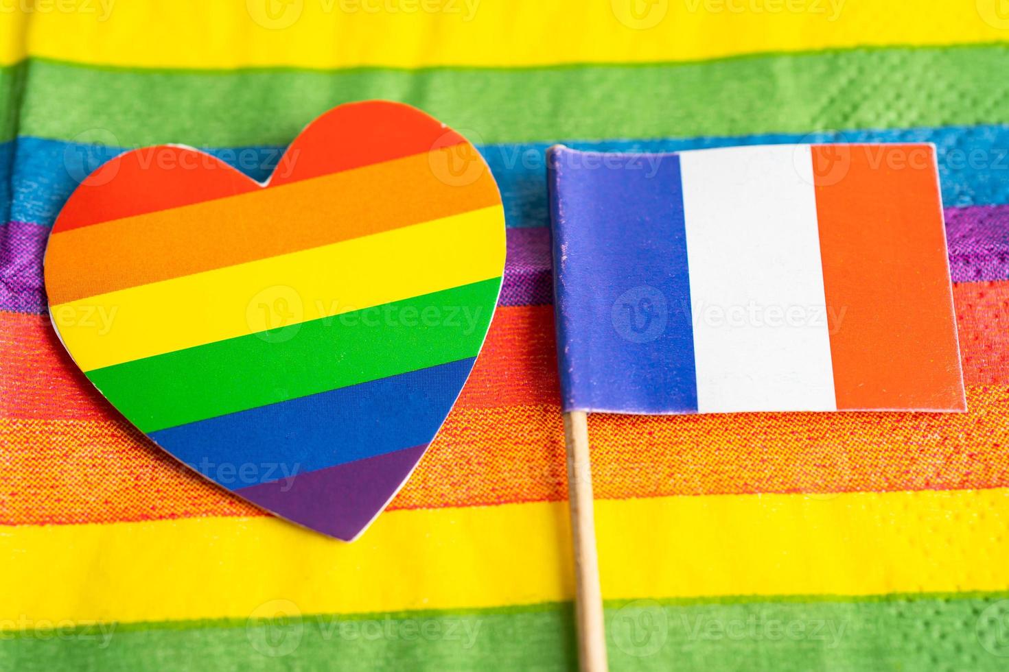 France flag on rainbow background symbol of LGBT gay pride month  social movement rainbow flag is a symbol of lesbian, gay, bisexual, transgender, human rights, tolerance and peace. photo