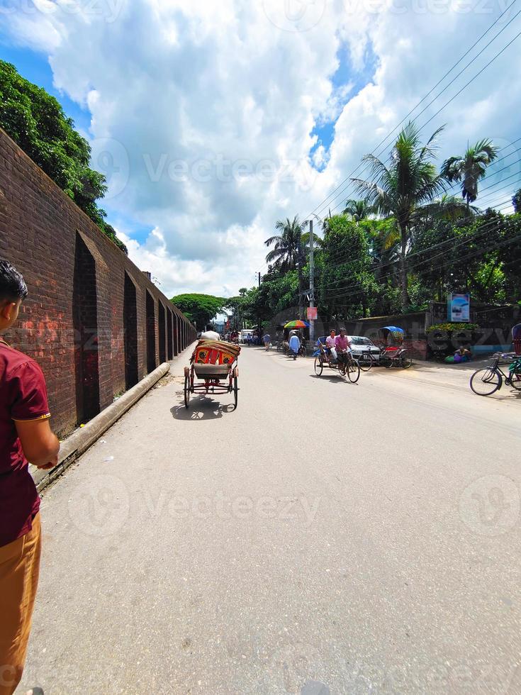 Bangladesh sylhet road with crowd rickshaw and beautiful sky photo
