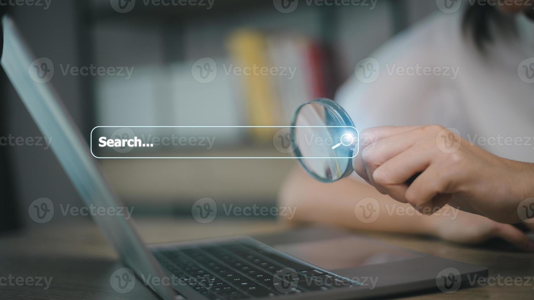 Woman use magnifying glass Search On Virtual Screen Data Search Technology Search Engine Optimization. Woman use computer to Searching for information. Using Search Console for data, info. photo