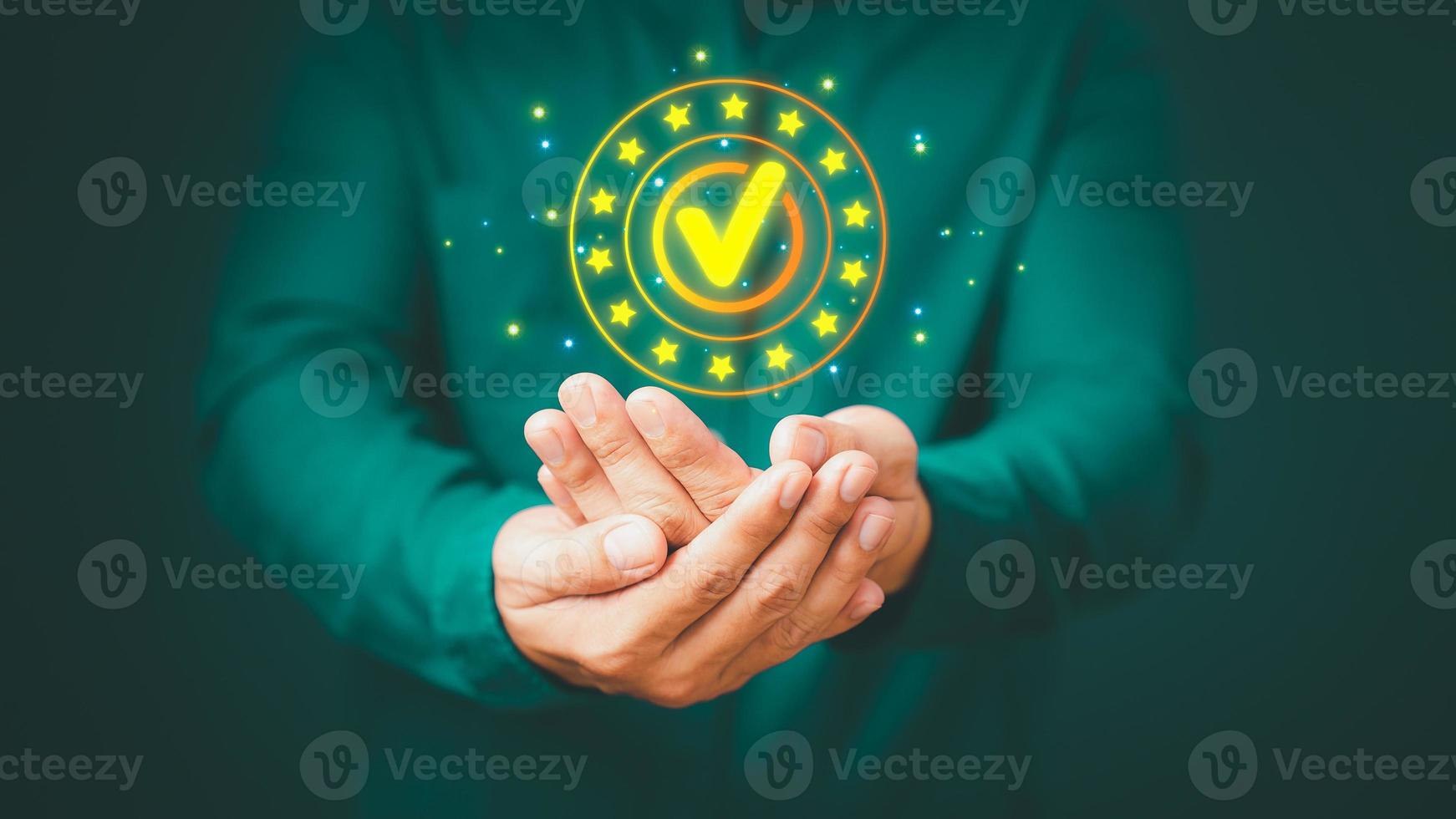Quality assurance of business services, Businessman holding and showing the best quality assurance with golden five stars. Guarantee, Standards, ISO certification and testimonial concept. photo
