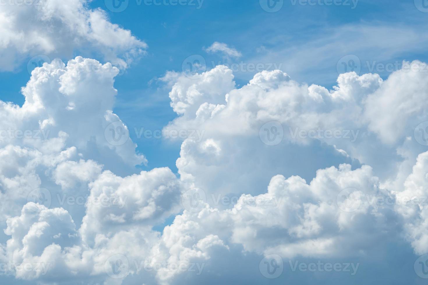 White fluffy clouds on blue sky. Soft touch feeling like cotton. White puffy cloudscape. Beauty in nature. Close-up white cumulus clouds texture background. Sky on sunny day. Pure white clouds. photo
