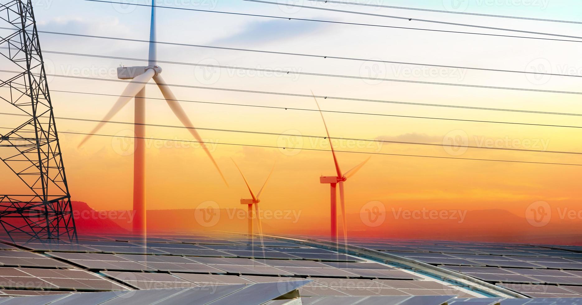 Sustainable energy. Solar farm, wind turbine, and electric pylon with sunset sky. Sustainable